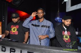photo of Highlanda Sound's Kahlil Wonda holding the microphone with DJ Passport (Right) and AGARD (left)